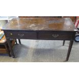 Edwardian mahogany two drawer side or writing table on fluted tapering legs.