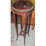 Stained mahogany two tier jardiniere stand.