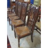 Set of four early 20th Century oak dining chairs with rush seats.