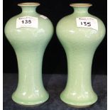 Pair of 20th Century Chinese green, crackle glaze, baluster vases. Four character marks to bases.