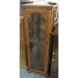 Modern pine narrow glazed display cabinet.