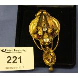 Gilt metal, gem set leaf and flower design bar brooch/pendant in associated box.