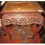 Oriental design hardwood rectangular two tier occasional table with fretwork foliate decoration.