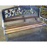 Wooden garden bench with case iron supports and florally decorated frame.