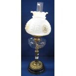 Early 20th Century double burner oil lamp with thumb cut glass reservoir on brass pedestal with