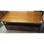 Modern hardwood rectangular two tier coffee table.