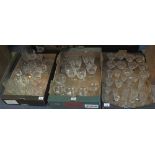 Three trays of assorted glassware to include: various drinking vessels; handkerchief vase;