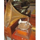 Vintage Apollo London gramophone with metal horn and a small collection of records.