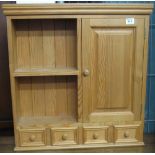 Modern natural pine kitchen wall unit with fitted spice drawers.