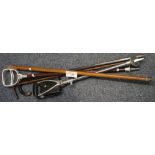 Two shooting sticks and three gentlemen's walking sticks with white metal terminals,