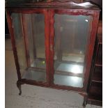 Early 20th Century mahogany display cabinet on cabriole legs.