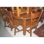Modern solid oak circular kitchen or dining table on chunky chamfered legs together with a set of