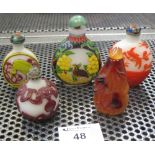 Group of five assorted Oriental glass snuff bottles, various.