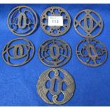 Collection of Japanese cast iron Tsuba sword guards of varying, pierced designs.