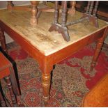 Early 20th Century stained pine kitchen table on baluster turned legs.