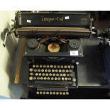 Vintage Imperial manual typewriter with additional projecting row of keys and a typewriter ribbon