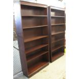 Three similar modern mahogany finish open bookcases.