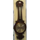 Negretti and Zambra, London, 28412 wall barometer and thermometer with silvered face, in a oak case.