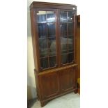 Early 20th Century mahogany glazed bookcase on bracket feet.