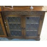 Mid 20th Century oak astragal glazed display cabinet on bracket feet.