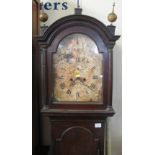 Early 19th Century mahogany long case clock with painted arched face marked: M.T.