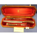 Cased Wade, Wingfield and Rowbotham three piece carving set with silver mounts and horn handles,