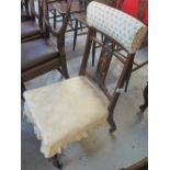 Edwardian inlaid bedroom chair on fluted legs and casters.