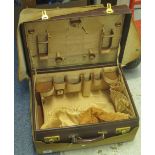 Vintage leather vanity case, opening to reveal a fitted interior of silk compartments,