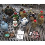 Group of assorted Oriental snuff bottles of various forms, glass and porcelain,