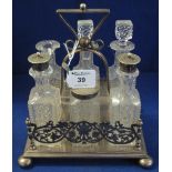 Early 20th Century silver plated six bottle cruet stand containing assorted cut glass condiments.