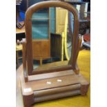 Small mahogany swivel toilet or bedroom mirror with pull-out drawer.