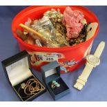 Tub of assorted costume jewellery, wristwatches, loose cutlery, chess figure etc.