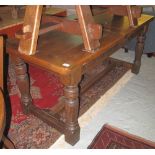 Early 20th Century solid oak, carved, refectory type table on fluted legs.
