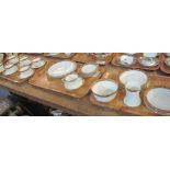 Three trays of Royal Albert Crown china teaware comprising: teacups and saucers; various plates;