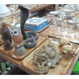 Two trays of carved wooden items to include: hardwood figure of a cobra; carved owl on rockwork;