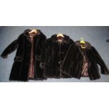 Two vintage dark brown faux fur button up coats and one dark brown faux fur jacket.