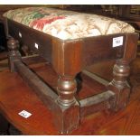 Mid 20th Century oak footstool with upholstered, foliate top.