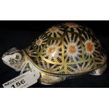 Royal Crown Derby bone china animal paperweight: Indian style tortoise with gold button stopper.