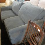 Modern blue upholstered large two seater sofa.
