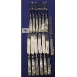 Set of six silver bladed knives and forks with mother-of-pearl handles,