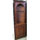 Reproduction mahogany corner cabinet.