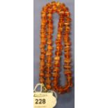 Graduated amber coloured bead necklace.