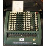 Sumlock comptometer with dust cover and original tuition fee card, dated: 1943.