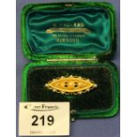 Yellow metal seed pearl flower head design bar brooch in original green velvet box.