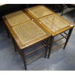 Pair of 20th Century mahogany and cane two seater stools.