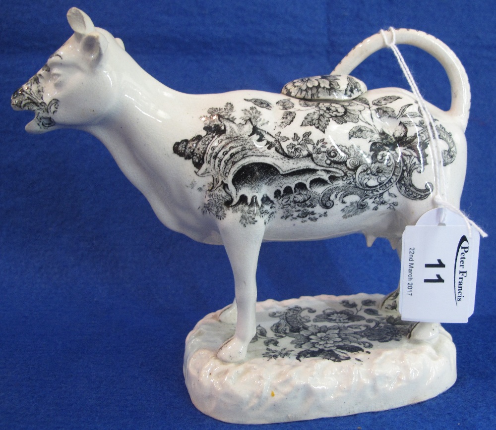 Swansea Pottery white transfer printed cow creamer decorated with seashells and foliage and having