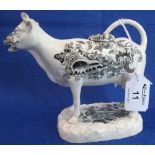 Swansea Pottery white transfer printed cow creamer decorated with seashells and foliage and having