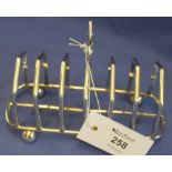 Silver Mappin and Webb six section toast rack, raised on four ball feet, Sheffield hallmarks.