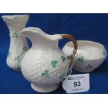 Belleek porcelain cane work, shamrock decorated cream jug and sucrier,