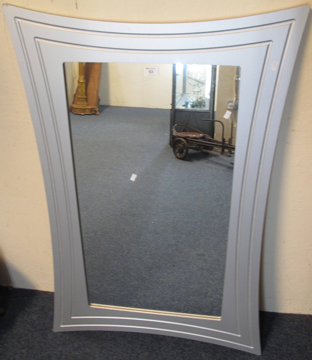 Modern silver framed, rectangular wall mirror.